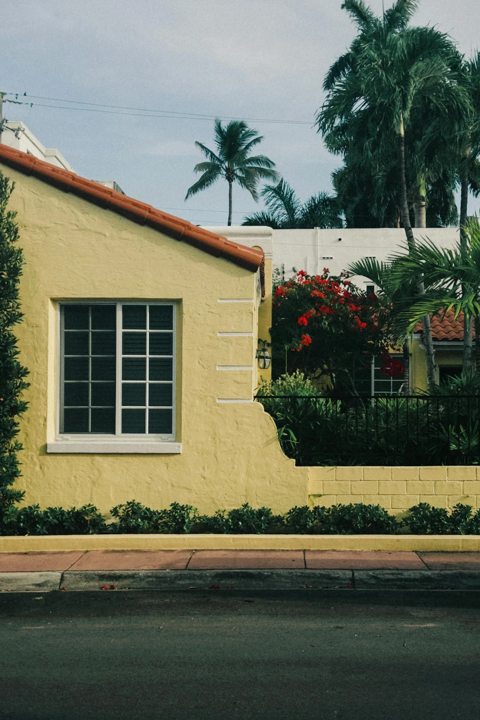 Charming yellow home with a tropical look and a new roof