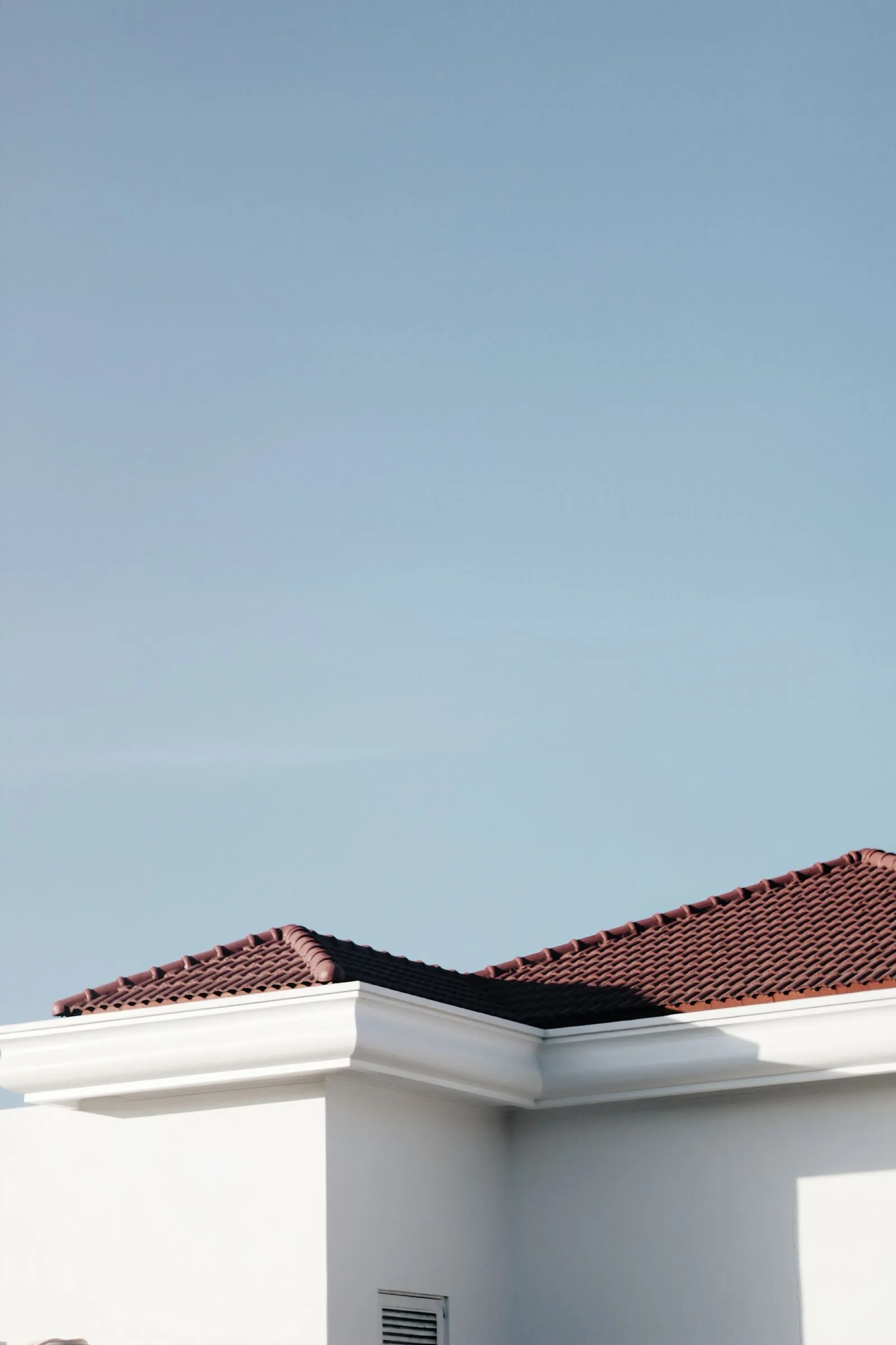 Freshly finished concrete roof against a clear blue sky